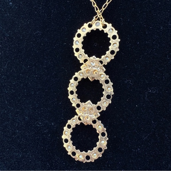Belladonna Circular Crystal and Gold Tone Infinity Pendant Necklace - Picture 17 of 17